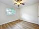 Bedroom with natural light, ceiling fan, and wood laminate flooring at 603 Solana St, Lakeland, FL 33813