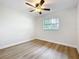 Empty bedroom featuring wood-look flooring and a window with natural light at 603 Solana St, Lakeland, FL 33813