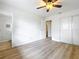 Bedroom boasts wood flooring, closet, and access to ensuite bathroom at 603 Solana St, Lakeland, FL 33813