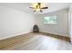 Bright bedroom featuring modern ceiling fan and wood-look flooring at 603 Solana St, Lakeland, FL 33813