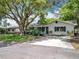Lovely single Gathering home with lush green lawn and mature trees providing ample shade at 603 Solana St, Lakeland, FL 33813