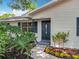 Charming single-story home with a striking front door, complemented by vibrant landscaping at 603 Solana St, Lakeland, FL 33813
