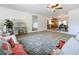 Inviting living room featuring hardwood floors, stylish decor, and seamless flow to the kitchen and dining areas at 603 Solana St, Lakeland, FL 33813