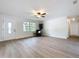 Bright and airy living room featuring hardwood floors, a ceiling fan, and a welcoming atmosphere at 603 Solana St, Lakeland, FL 33813