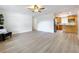 Spacious open-concept living area flows into kitchen with wood-look floors at 603 Solana St, Lakeland, FL 33813