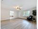 Well-lit living room featuring hardwood floors, providing a seamless transition to other rooms in the house at 603 Solana St, Lakeland, FL 33813