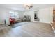 Spacious living room boasting hardwood floors, a comfortable sofa, and access to other living areas at 603 Solana St, Lakeland, FL 33813