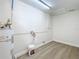 Utility room with water heater and connections for washer/dryer at 603 Solana St, Lakeland, FL 33813