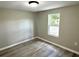Cozy bedroom with luxury vinyl plank flooring and natural light at 6611 Glen Meadow Loop, Lakeland, FL 33810