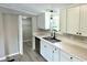 Stylish kitchen featuring quartz countertops, undermount sink, modern faucet and luxury vinyl plank flooring at 6611 Glen Meadow Loop, Lakeland, FL 33810
