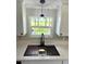 Close-up of kitchen sink featuring modern faucet and quartz countertops at 6611 Glen Meadow Loop, Lakeland, FL 33810