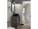 Contemporary bathroom featuring a black vessel sink, modern fixtures, and wood-look vanity at 7005 Dove Meadow Trl, Lakeland, FL 33810