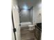Modern bathroom with a tiled shower, new toilet, and a stylish vanity with storage at 7005 Dove Meadow Trl, Lakeland, FL 33810
