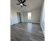 Spacious bedroom offers modern ceiling fan, closet, and a window bringing in natural light at 7005 Dove Meadow Trl, Lakeland, FL 33810