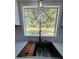 Kitchen sink looking out to the backyard, featuring a cutting board, sleek faucet, and lighting at 7005 Dove Meadow Trl, Lakeland, FL 33810