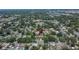 Aerial view of a property nestled among lush trees in a quiet neighborhood at 733 S Clayton Ave, Lakeland, FL 33801