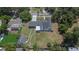 An overhead view reveals the property, its position on a lot with a yard and outbuilding at 733 S Clayton Ave, Lakeland, FL 33801