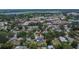 Birds-eye perspective shows the property nestled in its leafy surroundings with community amenities nearby at 733 S Clayton Ave, Lakeland, FL 33801