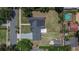 Aerial view of the property showcasing the pool, expansive yard, and surrounding neighborhood at 733 S Clayton Ave, Lakeland, FL 33801