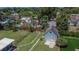 An aerial shot highlights the outbuilding, backyard, and its setting within the neighborhood's landscape at 733 S Clayton Ave, Lakeland, FL 33801