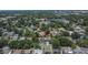 Wide aerial view shows property's location in a quiet residential neighborhood with mature trees at 733 S Clayton Ave, Lakeland, FL 33801