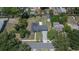 Aerial view showcases the home's well-maintained yard, pool, putting green and outdoor recreational spaces at 733 S Clayton Ave, Lakeland, FL 33801