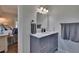 Bathroom featuring marble countertop, modern vanity, contemporary fixtures, and stylish mirror at 733 S Clayton Ave, Lakeland, FL 33801