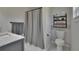Clean bathroom with modern vanity, marble countertop, hexagonal tile floor, and updated fixtures at 733 S Clayton Ave, Lakeland, FL 33801