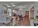 Open-concept space featuring dining area with wood floors, plenty of light, and view into the living room at 733 S Clayton Ave, Lakeland, FL 33801