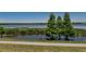 Waterfront scenic view of a lake with a paved trail and lush greenery at 733 S Clayton Ave, Lakeland, FL 33801