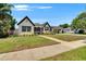 Charming two-story home featuring a well-manicured lawn and beautiful landscaping at 733 S Clayton Ave, Lakeland, FL 33801