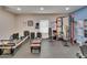 Home gym with a variety of exercise equipment including a Pilates machine, weights, and a pull-up station at 733 S Clayton Ave, Lakeland, FL 33801