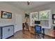 Bright home office featuring hardwood floors, natural light, and a comfortable work space at 733 S Clayton Ave, Lakeland, FL 33801