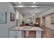 Bright eat-in kitchen area open to the living room and dining room, featuring granite countertops at 733 S Clayton Ave, Lakeland, FL 33801