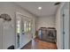 Laundry room featuring modern washer and dryer units and French doors leading to the outside at 733 S Clayton Ave, Lakeland, FL 33801