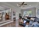 Spacious living room featuring hardwood floors and an open layout to the kitchen at 733 S Clayton Ave, Lakeland, FL 33801