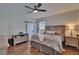 Main bedroom features hardwood floors, a ceiling fan, and gray interior at 733 S Clayton Ave, Lakeland, FL 33801