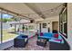 Cozy patio with brick flooring, outdoor furniture, and string lights for evening ambiance at 733 S Clayton Ave, Lakeland, FL 33801