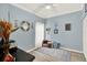 Tranquil bedroom with soft blue walls, decorative accents, and a cozy reading nook at 804 Magnolia Pl # 804, Winter Haven, FL 33884