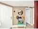 Welcoming entryway with decorative mirror and a colorful accent chair at 804 Magnolia Pl # 804, Winter Haven, FL 33884
