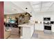 Bright open kitchen with stainless steel appliances and views into the living area at 804 Magnolia Pl # 804, Winter Haven, FL 33884