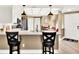 Updated kitchen with a breakfast bar that opens into the dining area at 804 Magnolia Pl # 804, Winter Haven, FL 33884