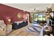 Bright living room with hardwood floors, a large sliding glass door, and comfortable furniture at 804 Magnolia Pl # 804, Winter Haven, FL 33884