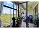 This patio is filled with plants and glass windows, offering great views of the outside at 804 Magnolia Pl # 804, Winter Haven, FL 33884
