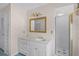 Bathroom with a single sink vanity, shower, and medicine cabinet at 900 Howard Nw Ter, Winter Haven, FL 33881