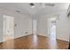 Open floor plan bedroom with parquet floors and three entry points at 900 Howard Nw Ter, Winter Haven, FL 33881