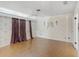Inviting bedroom with parquet floors, decorative wallpaper, and light fixture at 900 Howard Nw Ter, Winter Haven, FL 33881