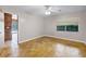 Bedroom with parquet floors, neutral walls, and a window with backyard views at 900 Howard Nw Ter, Winter Haven, FL 33881