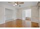 Cozy dining room featuring hardwood floors and an opening to the living room at 900 Howard Nw Ter, Winter Haven, FL 33881