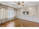 Well-lit dining room with built-in cabinets, decorative trim, and hardwood floors at 900 Howard Nw Ter, Winter Haven, FL 33881